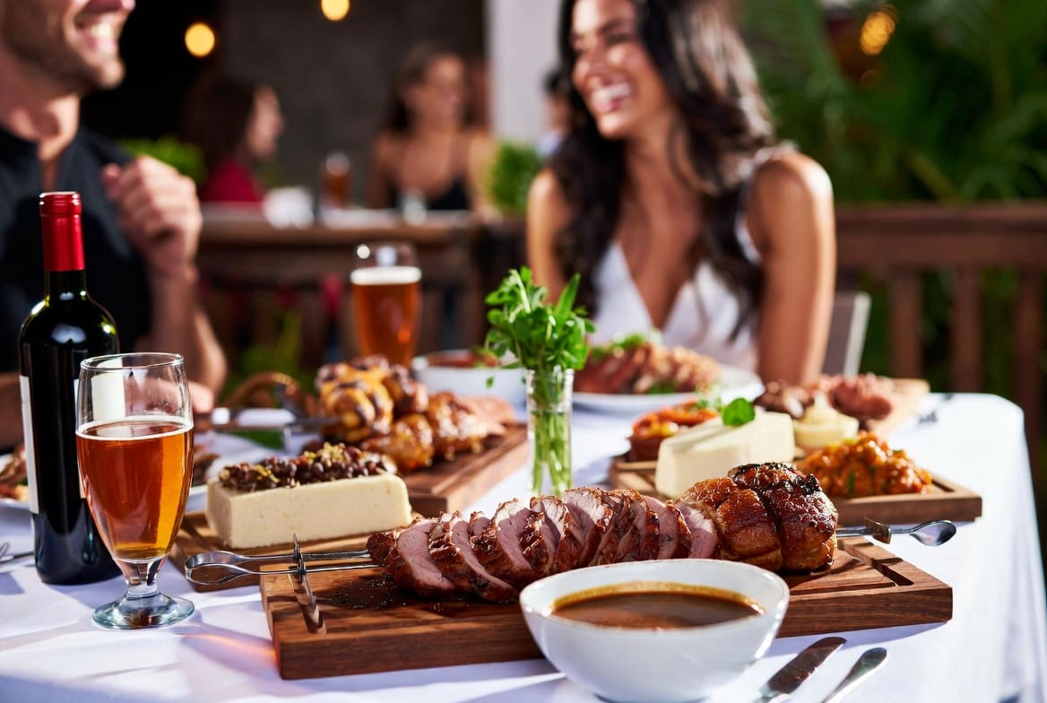 Beautifully presented spit braai meal with sides at an outdoor event, offering better value and experience than many restaurants near me